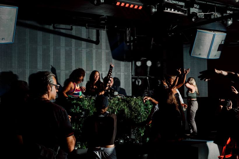 Spin Lab DJs at the decks with the crowd around them